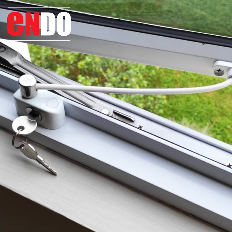 Window Restrictors : white Ezi Lock with cables installed
